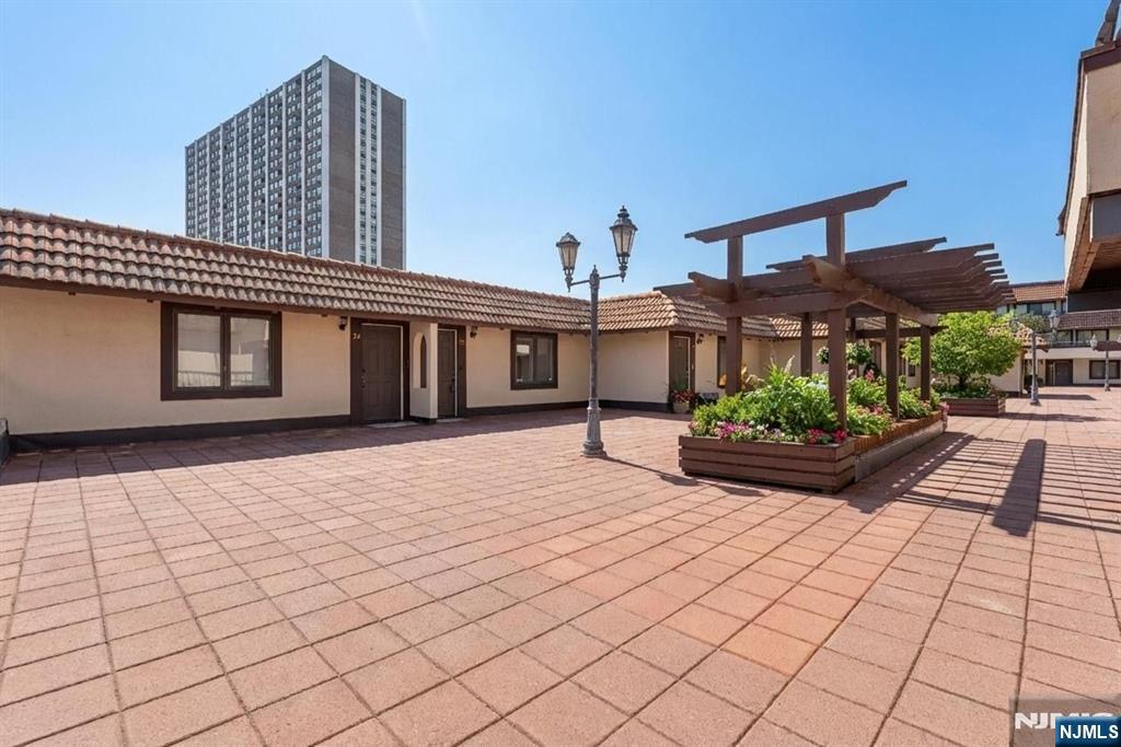 300 Gorge Road, Unit 25 Cliffside Park, NJ 07010 - Photo 3 of 45 a view of a house with a bench