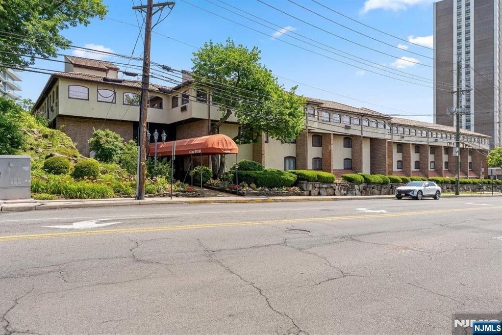 300 Gorge Road, Unit 25 Cliffside Park, NJ 07010 - Photo 35 of 45 a front view of a building with cars parked