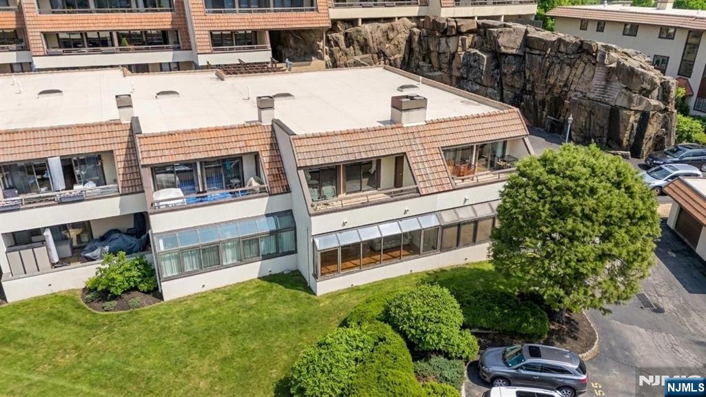 300 Gorge Road, Unit 25 Cliffside Park, NJ 07010 - Photo 36 of 45 a view of a white building among the tall windows