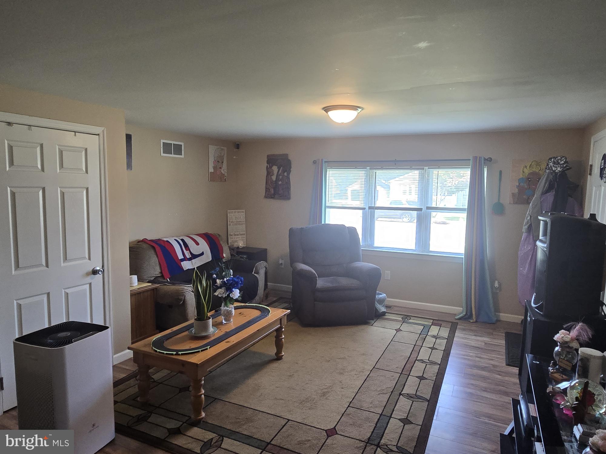 13 Alloway Road Woodstown, NJ 08098 - Photo 4 of 11 a living room with furniture a window and a flat screen tv
