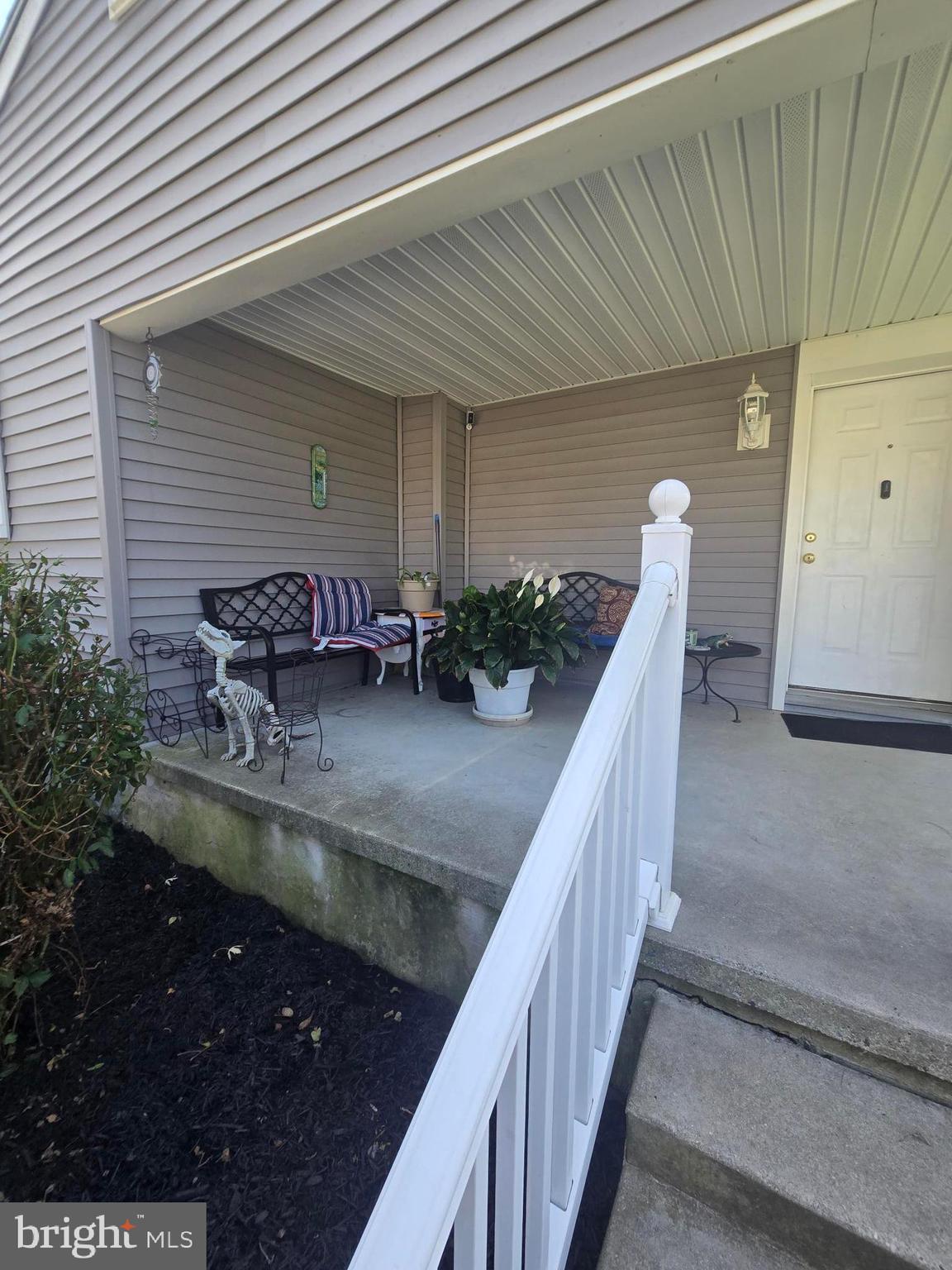 13 Alloway Road Woodstown, NJ 08098 - Photo 9 of 11 a view of a balcony with two chairs