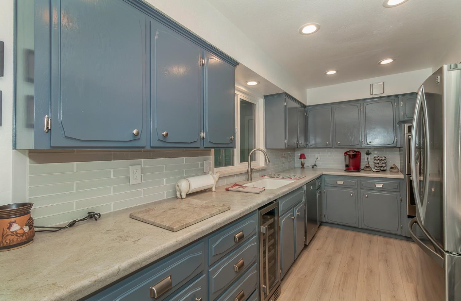 1930 Cougar Lane Clovis, CA 93611 - Photo 12 of 34 a kitchen with a sink and cabinets