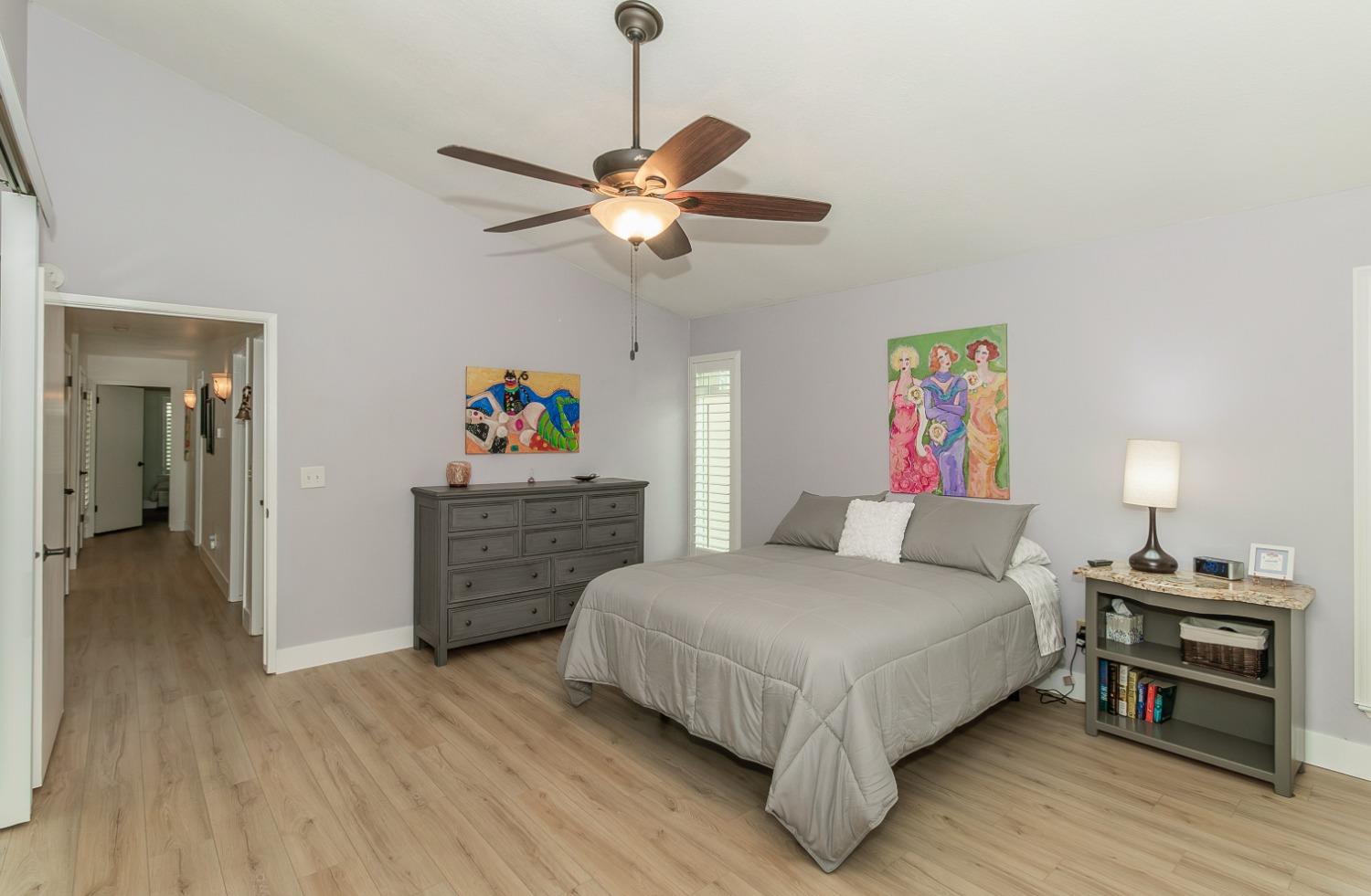 1930 Cougar Lane Clovis, CA 93611 - Photo 19 of 34 a bedroom with a bed and wooden floor