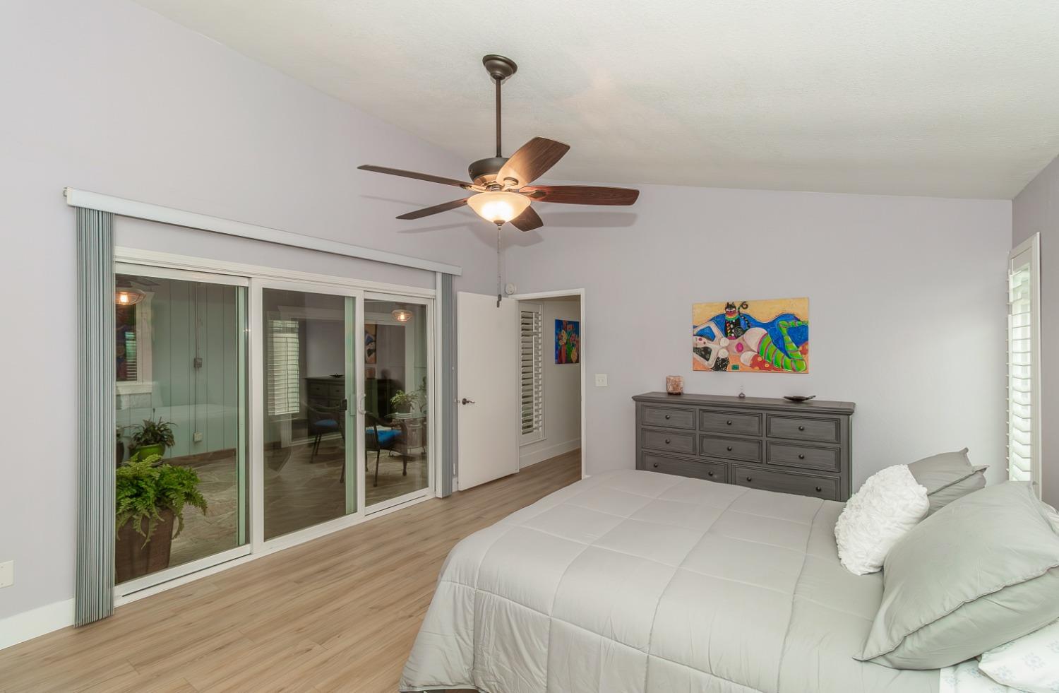 1930 Cougar Lane Clovis, CA 93611 - Photo 20 of 34 a bedroom with a bed dresser and a window