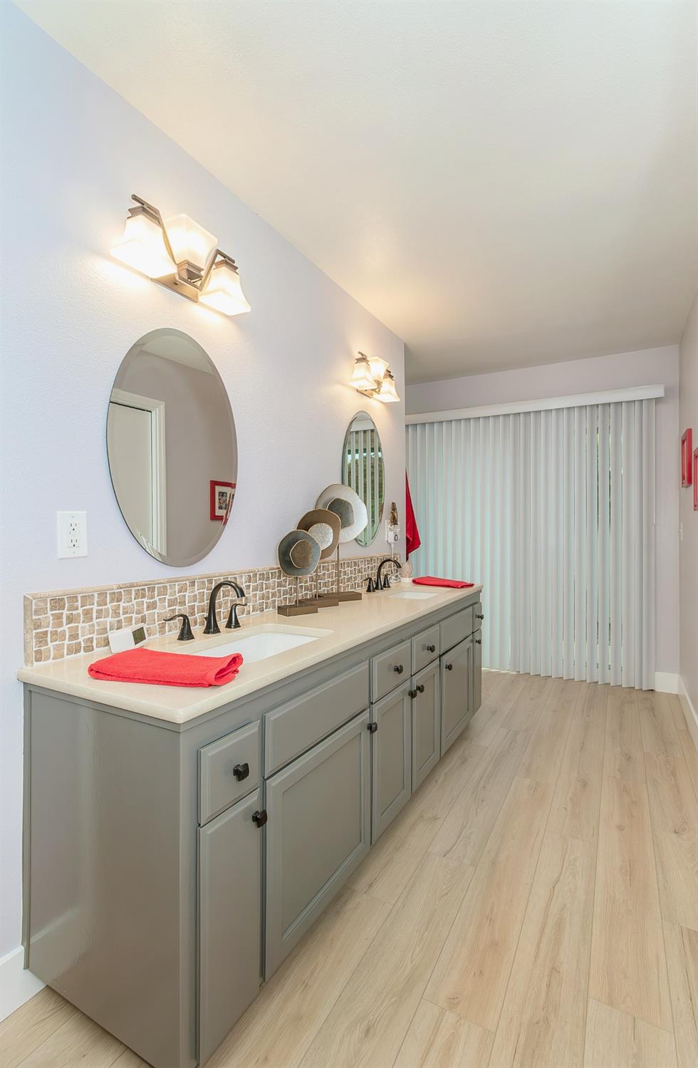 1930 Cougar Lane Clovis, CA 93611 - Photo 21 of 34 a bathroom with a sink and a mirror