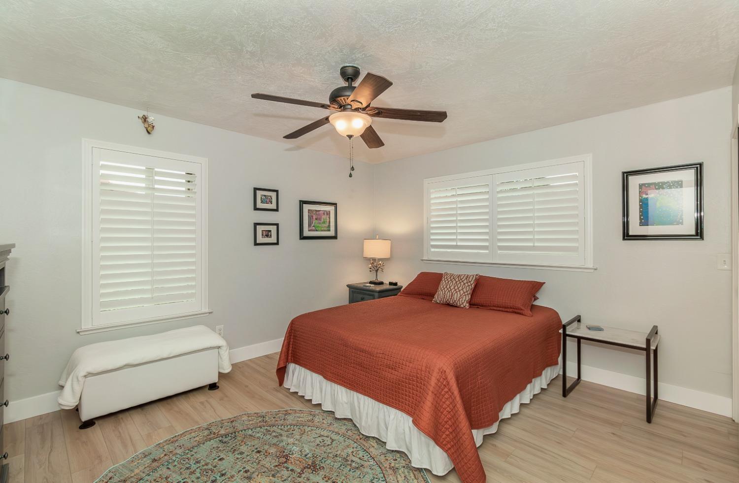 1930 Cougar Lane Clovis, CA 93611 - Photo 26 of 34 a bedroom with a bed and a couch