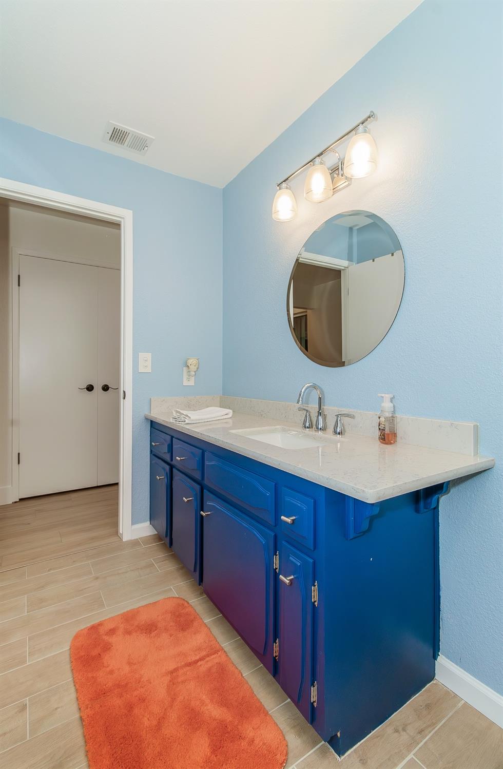 1930 Cougar Lane Clovis, CA 93611 - Photo 30 of 34 a bathroom with a sink and a mirror