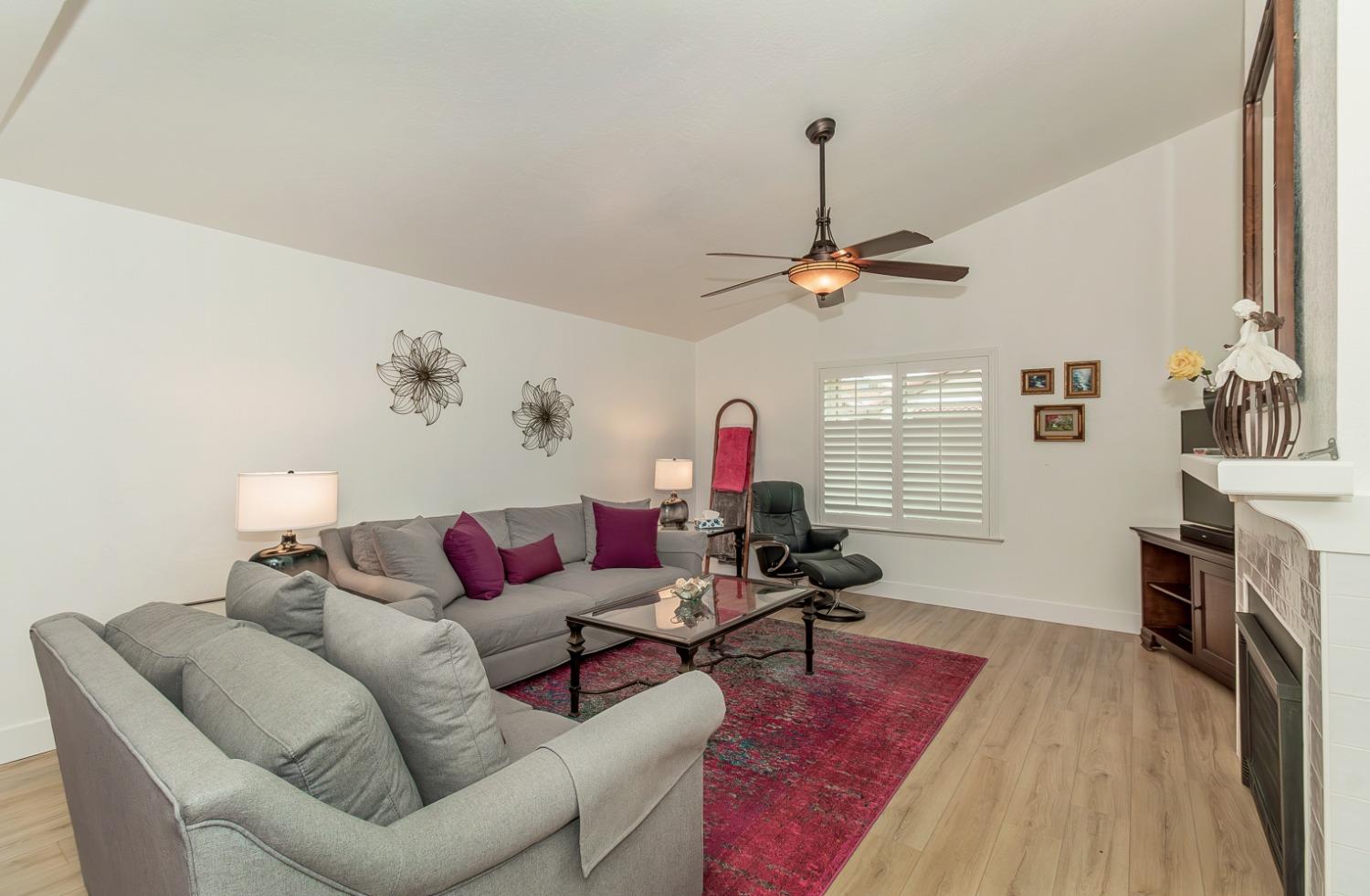 1930 Cougar Lane Clovis, CA 93611 - Photo 3 of 34 a living room with furniture and a wooden floor