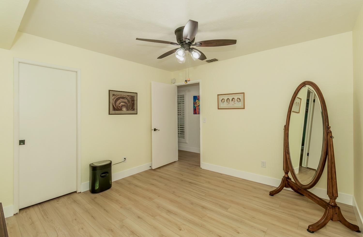 1930 Cougar Lane Clovis, CA 93611 - Photo 32 of 34 a view of a room with wooden floor and windows