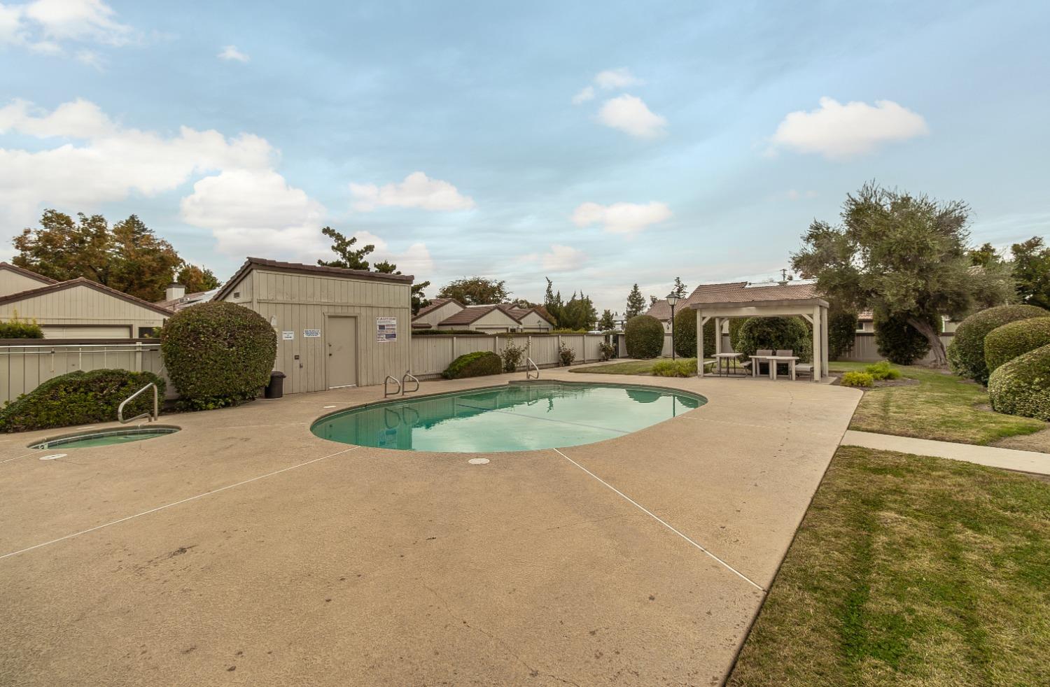 1930 Cougar Lane Clovis, CA 93611 - Photo 34 of 34 a view of a swimming pool with a yard