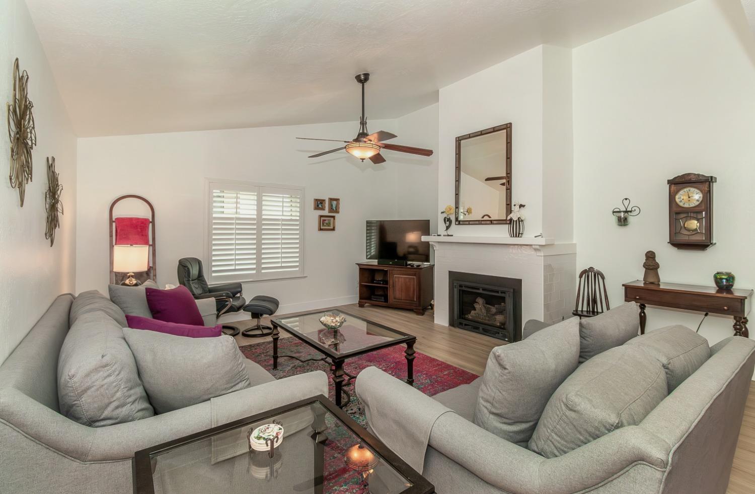 1930 Cougar Lane Clovis, CA 93611 - Photo 4 of 34 a living room with furniture and a fireplace