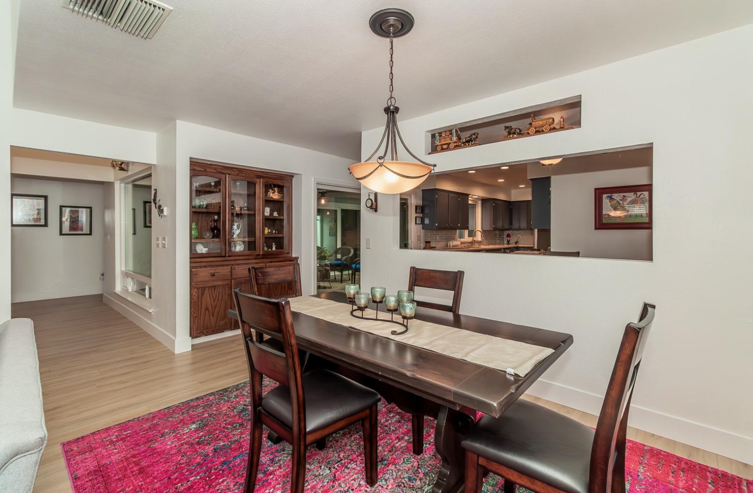 1930 Cougar Lane Clovis, CA 93611 - Photo 7 of 34 a view of a dining room with furniture
