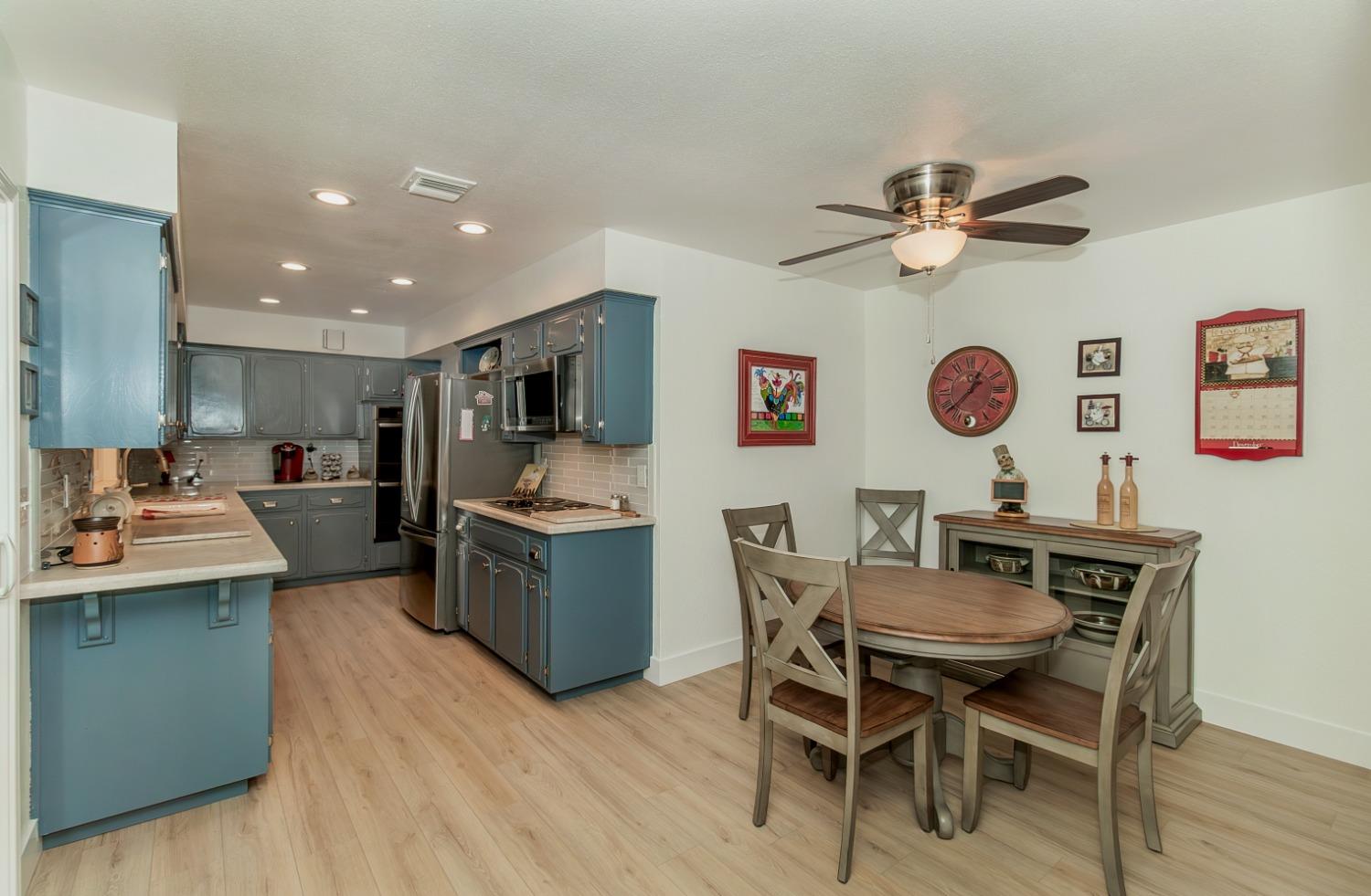 1930 Cougar Lane Clovis, CA 93611 - Photo 10 of 34 a view of kitchen with cabinets table and chairs