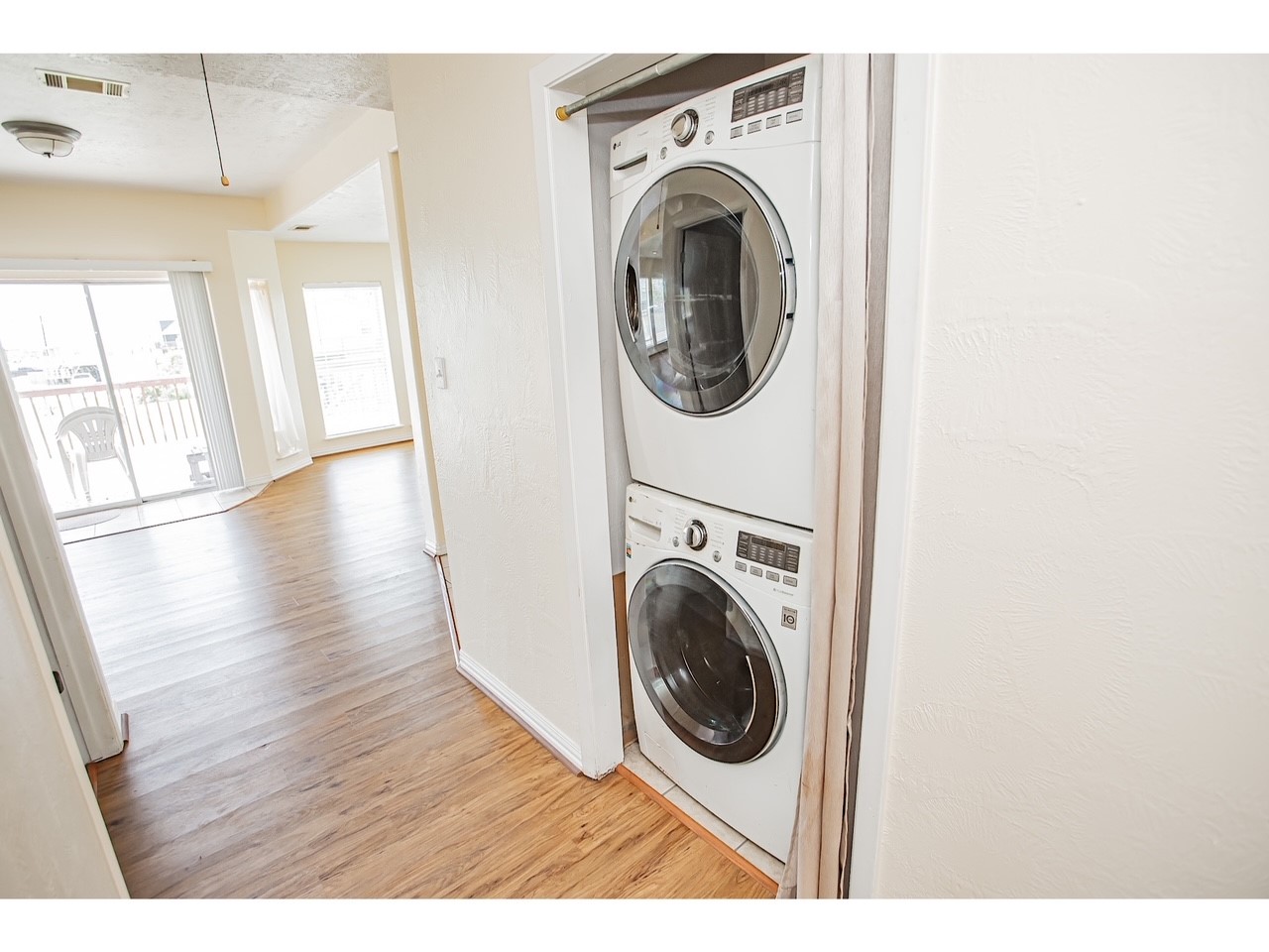 419 Thunder Road Surfside Beach, TX 77541 - Photo 16 of 32 Conveniently located off the hallway, a modern washer and dryer offer easy access.