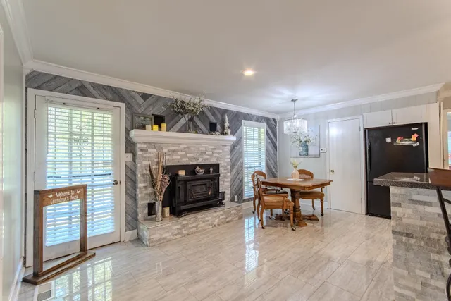 a view of a livingroom with furniture and a fireplace