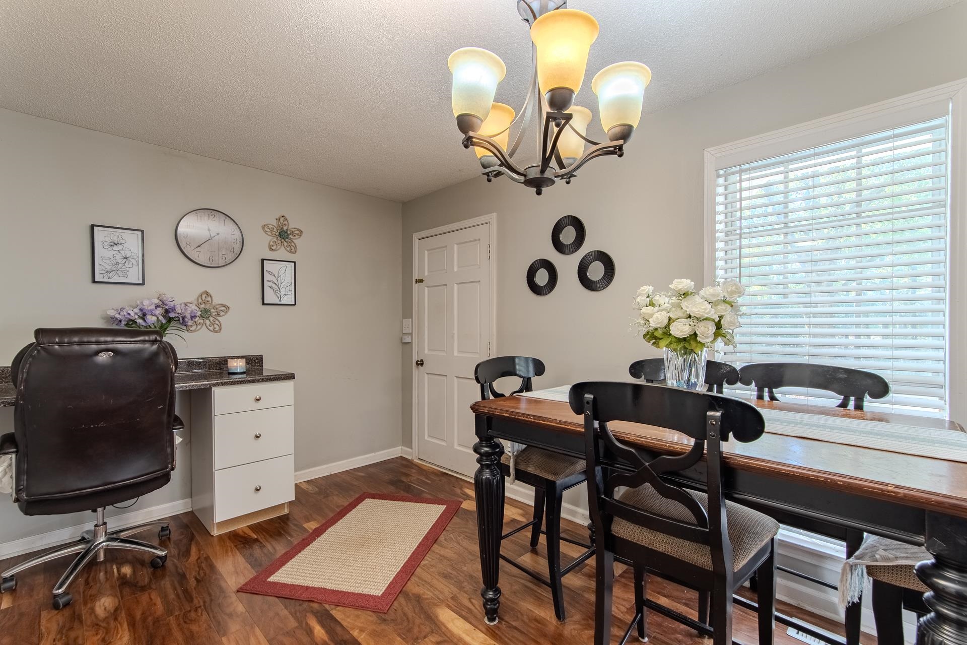 3095 Buster Road Middleton, TN 38052 - Photo 14 of 36 a view of a dining room with furniture and chandelier