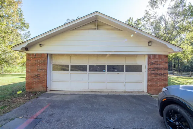 a front view of a house with a garage