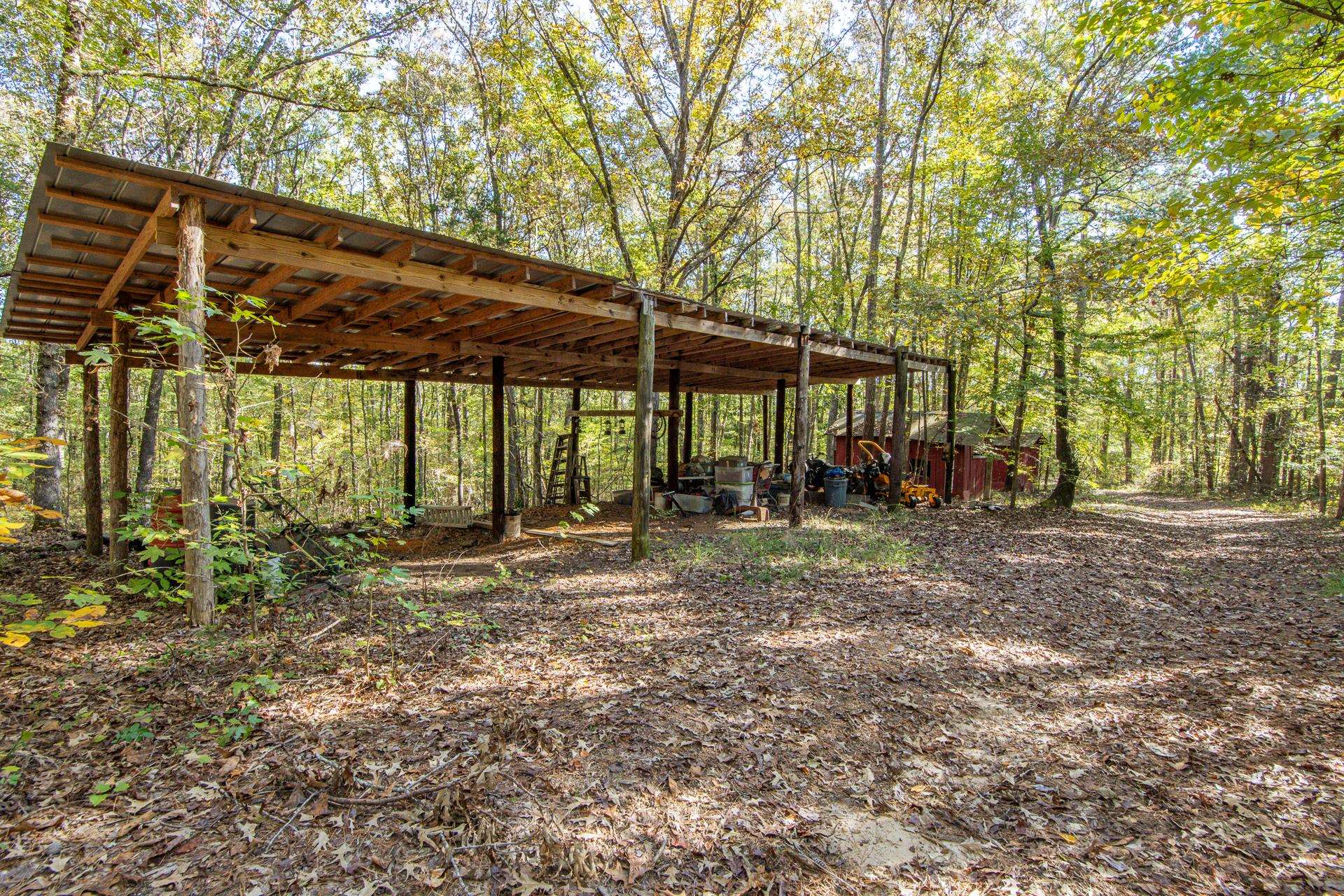 3095 Buster Road Middleton, TN 38052 - Photo 28 of 36 a view of a backyard with table and chairs under an umbrella