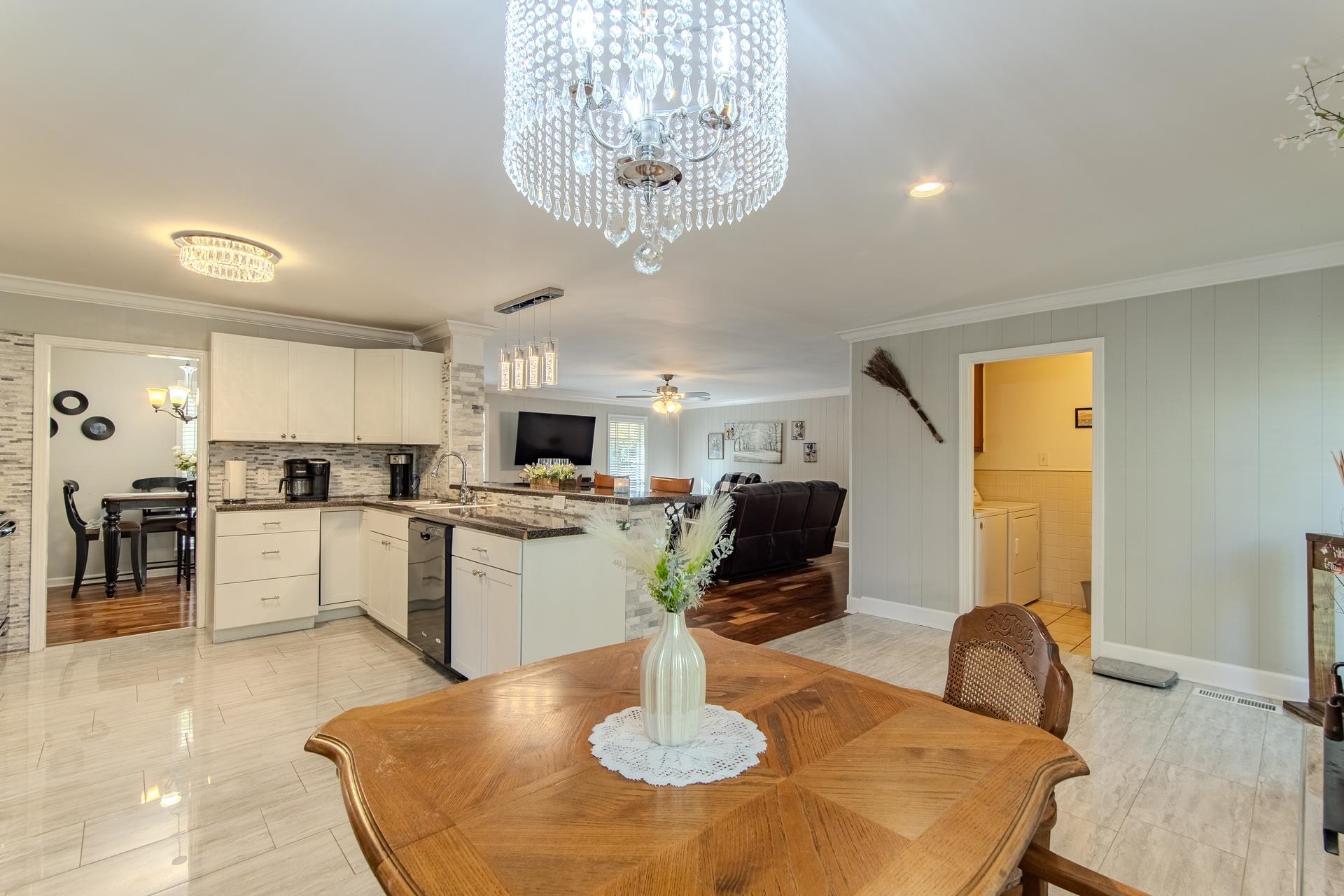 3095 Buster Road Middleton, TN 38052 - Photo 9 of 36 a kitchen with a dining table chairs sink and microwave