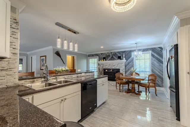 a kitchen with a stove and a refrigerator