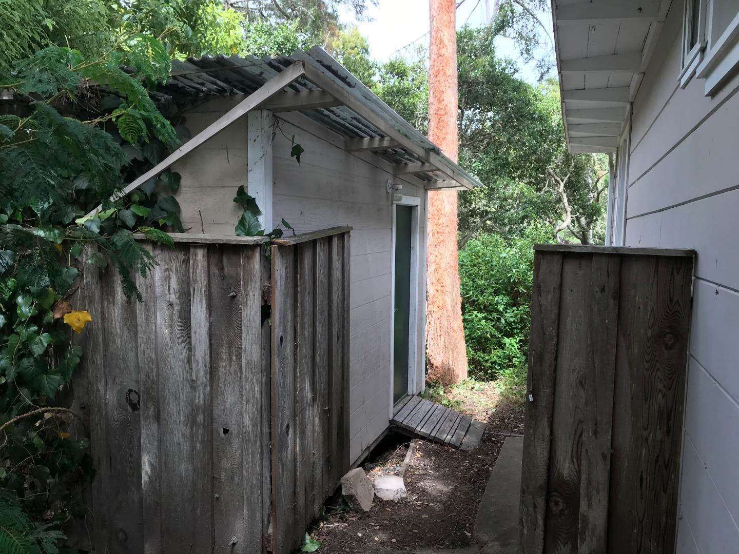 3-12th Junipero Avenue Carmel, CA 93923 - Photo 11 of 14 a wooden door with a wooden fence