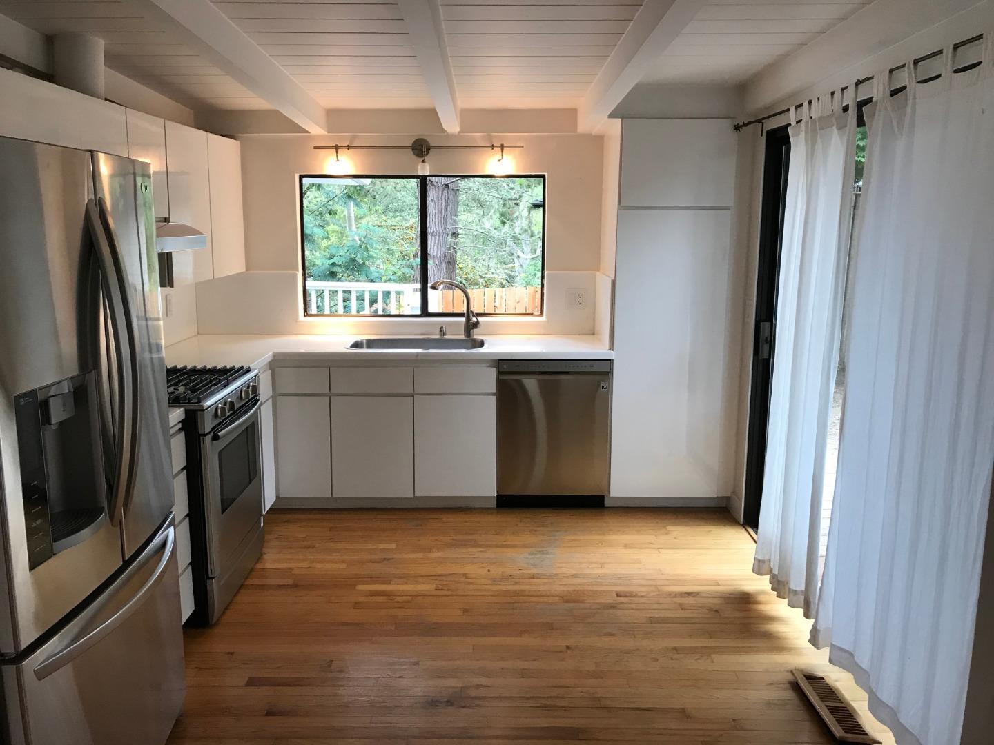 3-12th Junipero Avenue Carmel, CA 93923 - Photo 5 of 14 a kitchen with stainless steel appliances granite countertop a refrigerator and a sink