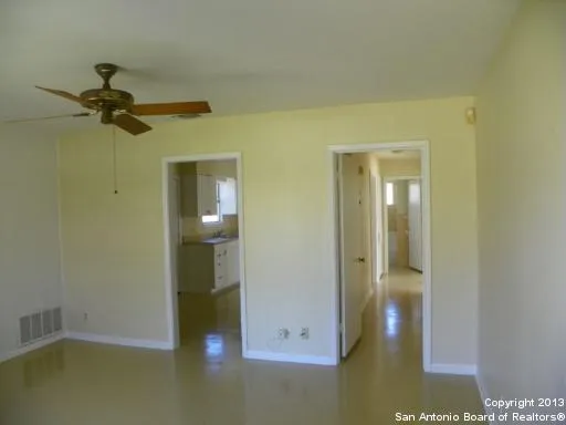 a view of a hallway with a room