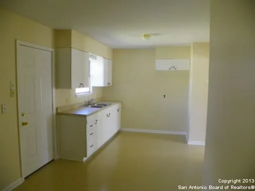 a bathroom with a sink a toilet and a shower