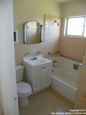 a bathroom with a sink a toilet and a bathtub