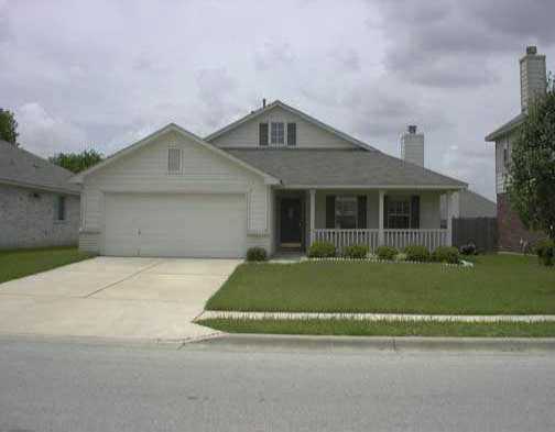 15012 Jacks Pond Road Austin, TX 78728 - Photo 1 of 1 a front view of a house with a garden