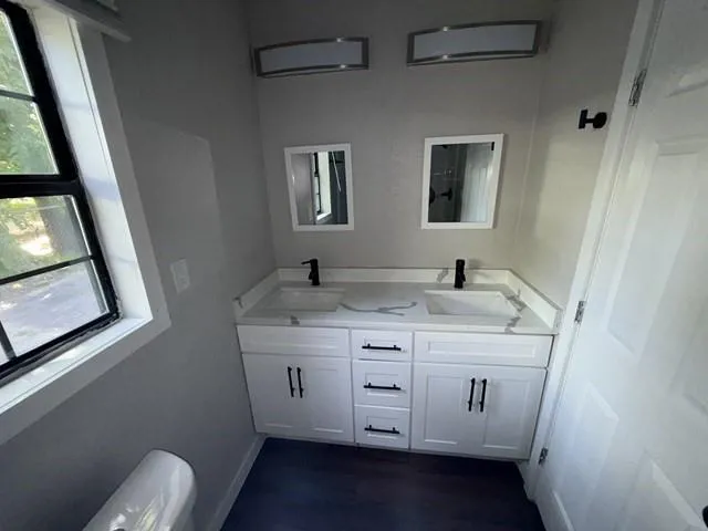 a kitchen with a sink and a stove top oven