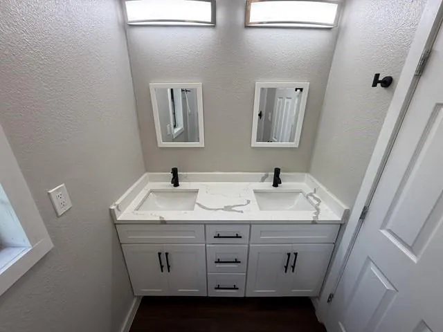 a white toilet sitting next to a bath tub