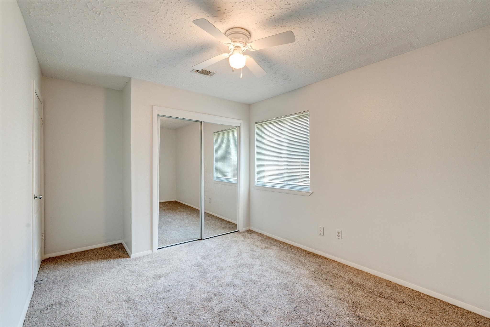 3726 Acorn Run Lane Spring, TX 77389 - Photo 23 of 27 an empty room with a ceiling fan and a window