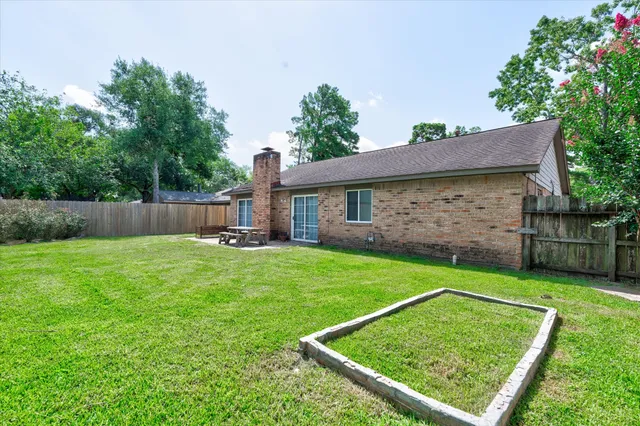 a front view of house with yard and outdoor seating