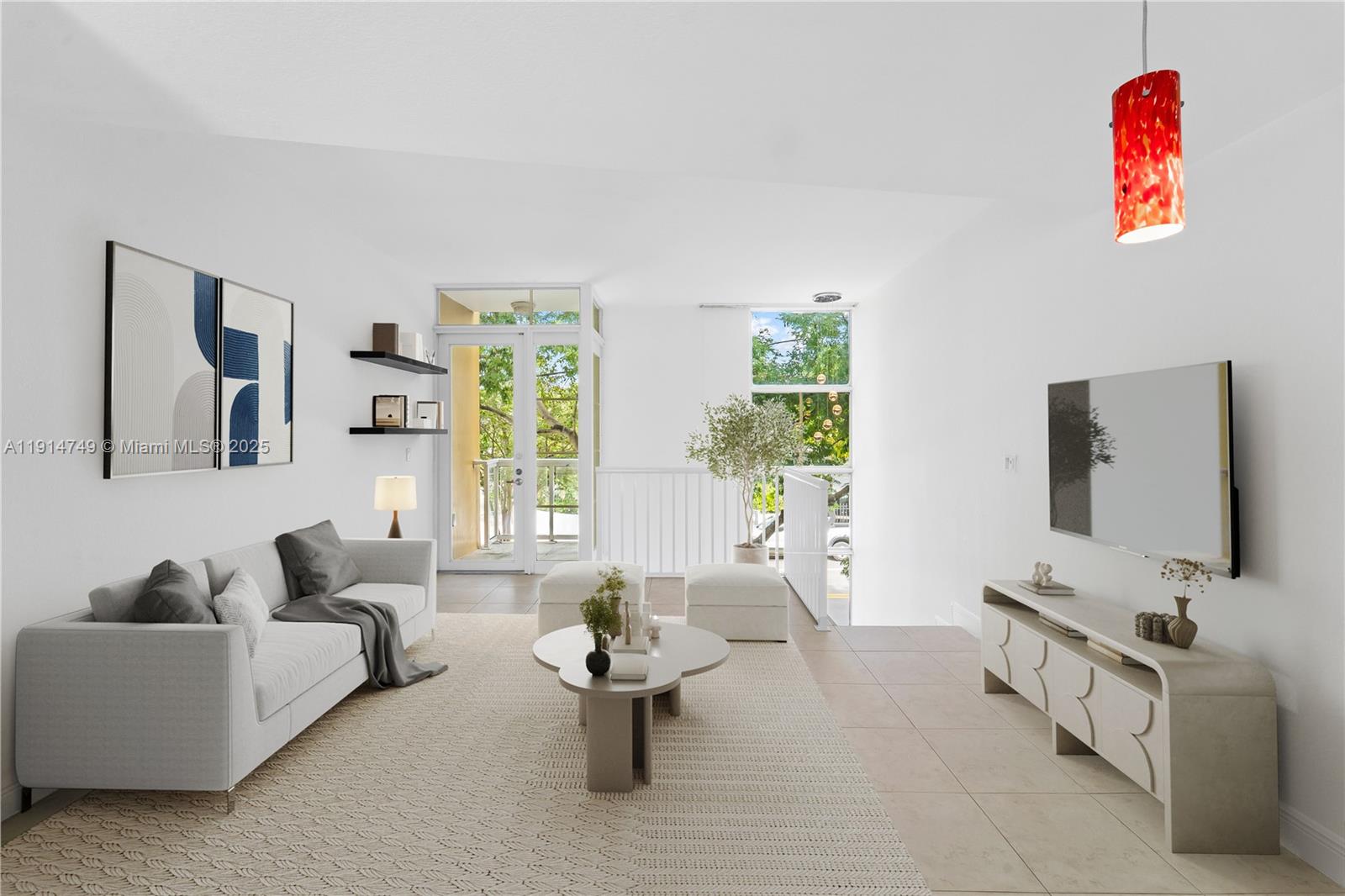 8041 Harding Avenue, Unit 105 Miami Beach, FL 33141 - Photo 2 of 23 a living room with furniture and a flat screen tv