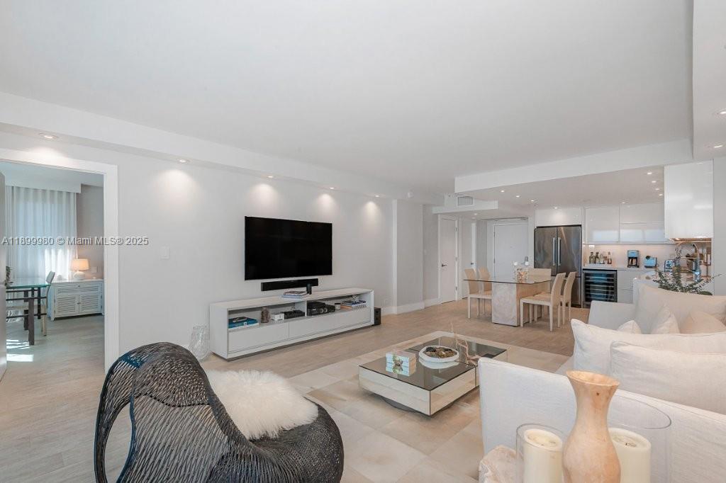 2301 Collins Avenue, Unit 738 Miami Beach, FL 33139 - Photo 13 of 33 a living room with furniture and a flat screen tv