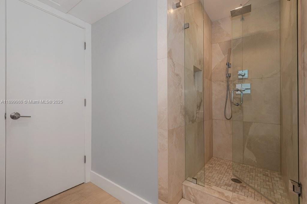 2301 Collins Avenue, Unit 738 Miami Beach, FL 33139 - Photo 18 of 33 a bathroom with a shower