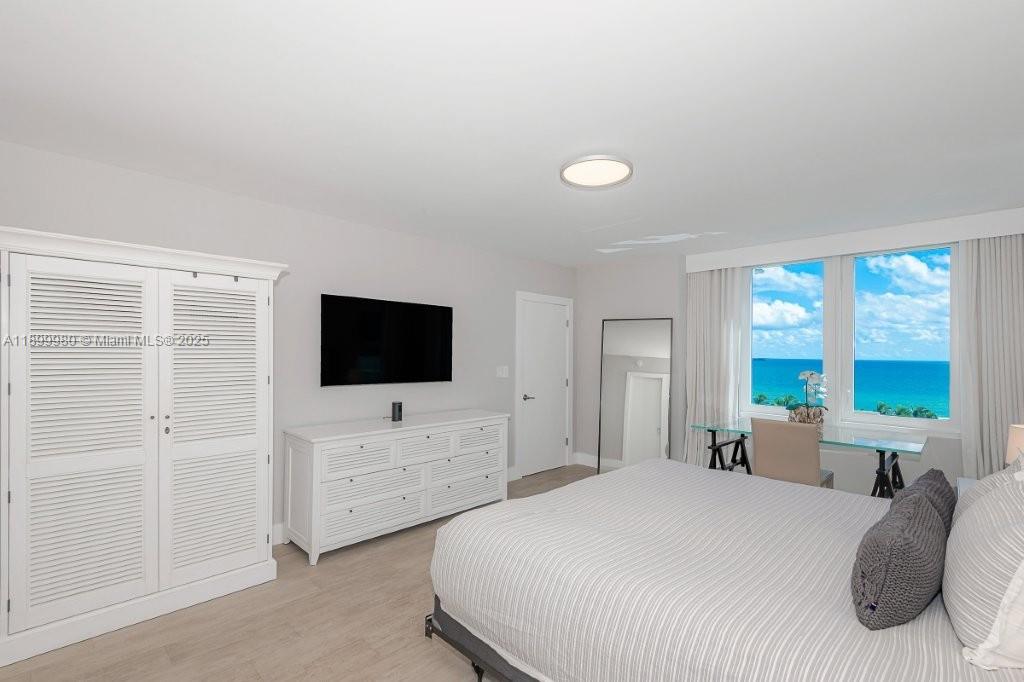 2301 Collins Avenue, Unit 738 Miami Beach, FL 33139 - Photo 3 of 33 a bedroom with a bed and a flat screen tv