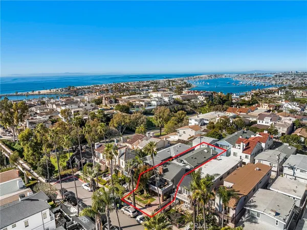 an aerial view of a city with ocean view