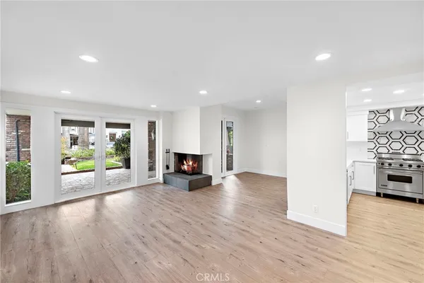 a view of kitchen with furniture and wooden floor