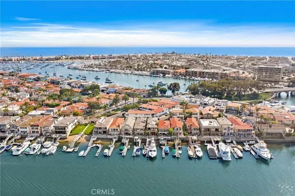 an aerial view of multiple house with yard