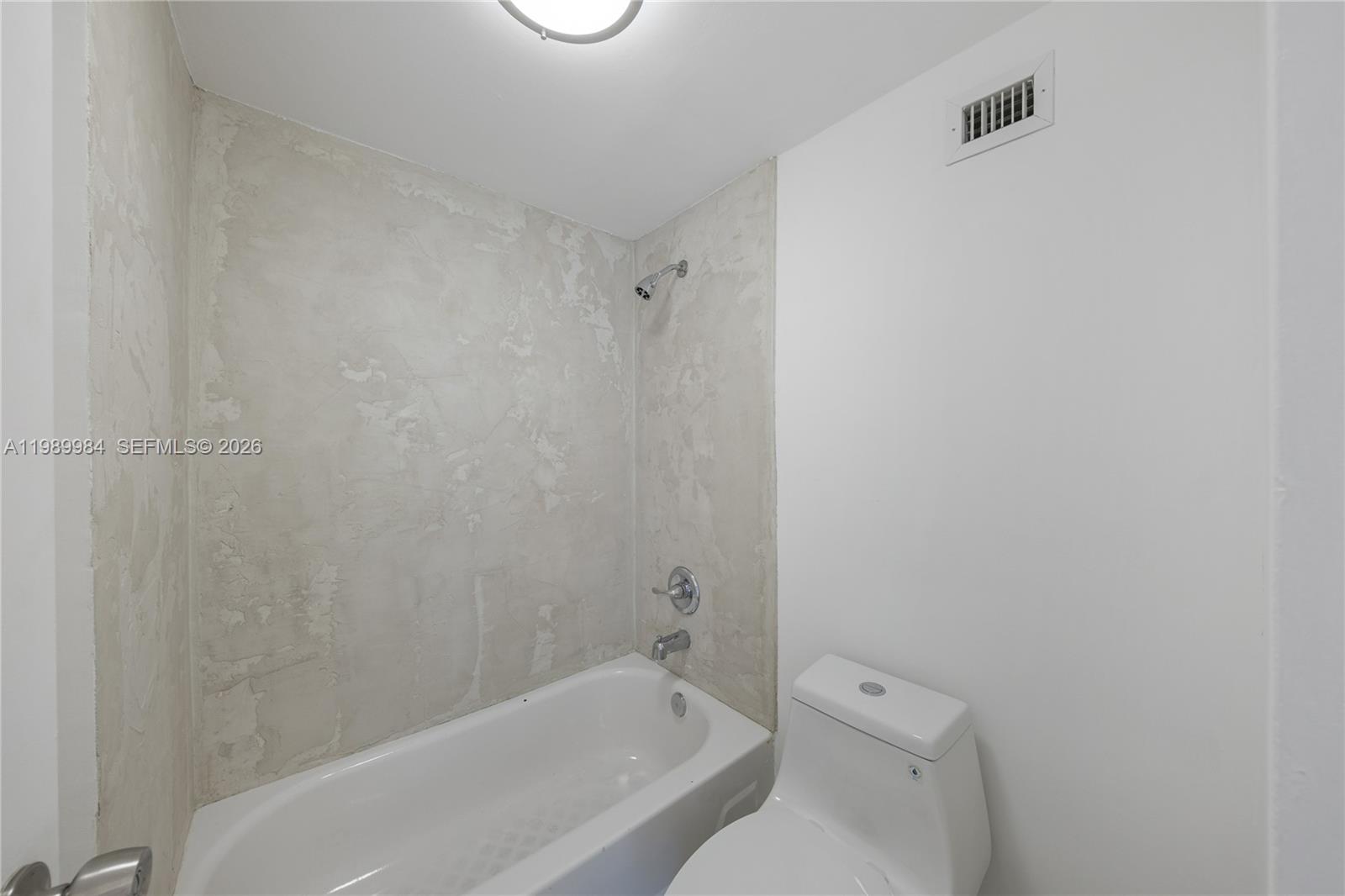 100 Lincoln Road, Unit 626 Miami Beach, FL 33139 - Photo 11 of 12 a bathroom with a bathtub and toilet