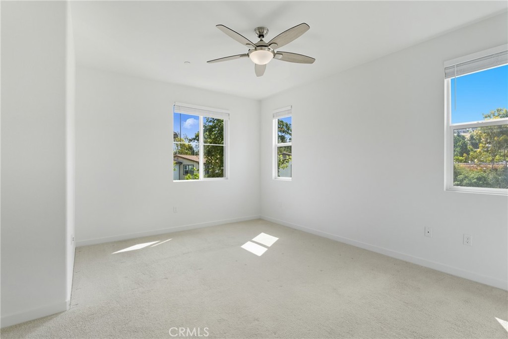 4211 Mission Ranch Way Oceanside, CA 92057 - Photo 19 of 40 an empty room with windows and fan