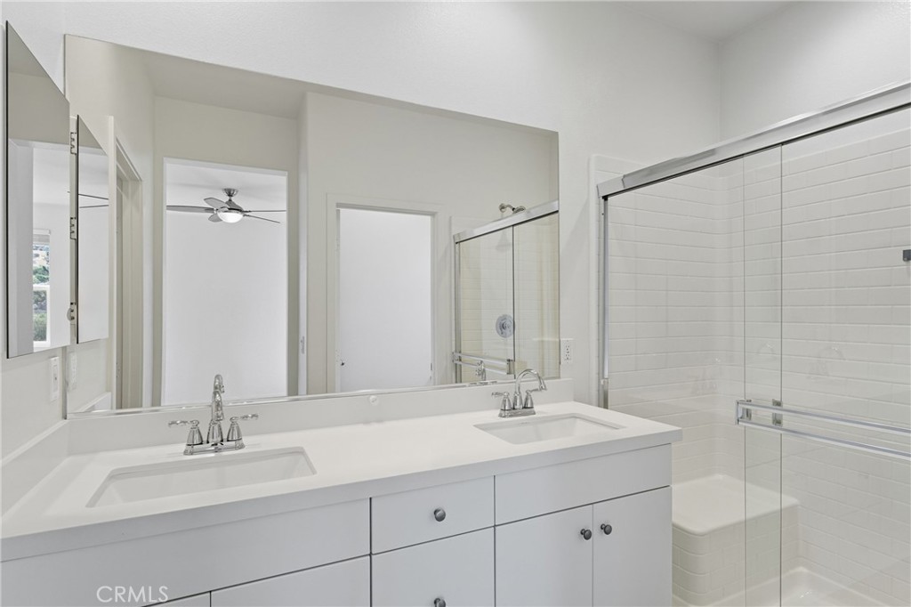 4211 Mission Ranch Way Oceanside, CA 92057 - Photo 22 of 40 a bathroom with a sink and a mirror