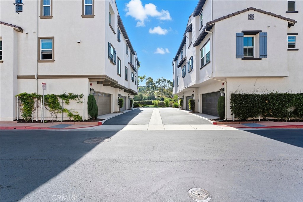 4211 Mission Ranch Way Oceanside, CA 92057 - Photo 26 of 40 a front view of a building with green space