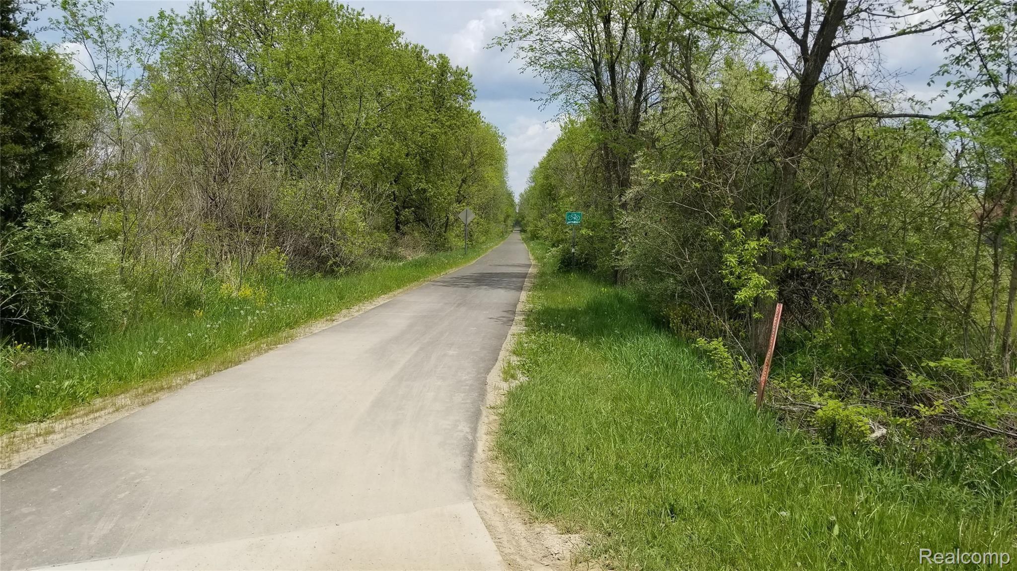 0 Twelve Mile Road New Hudson, MI 48165 - Photo 7 of 8 Rail Trail on the west side of property