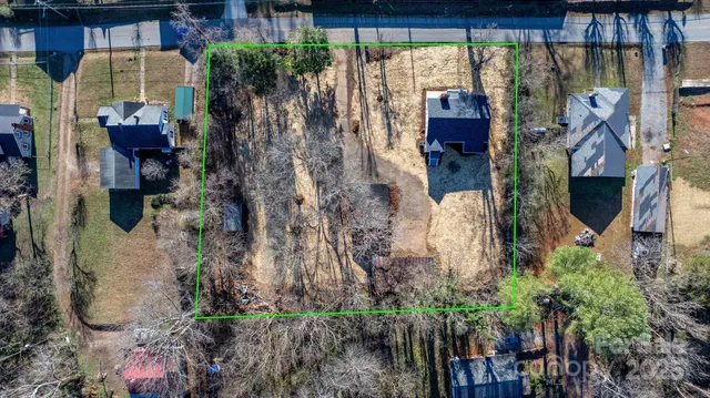 a bird view of a house with a yard