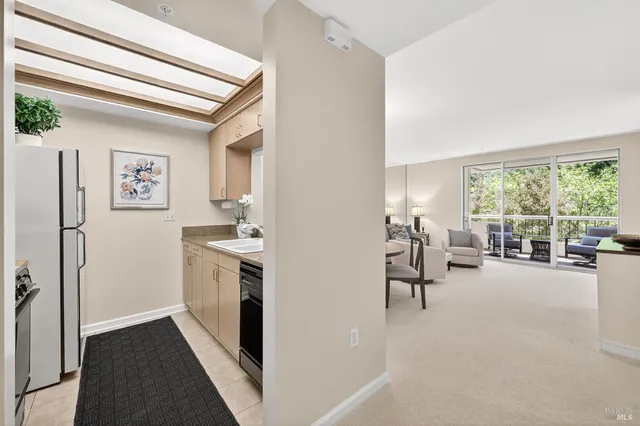a view of a livingroom with furniture and a window