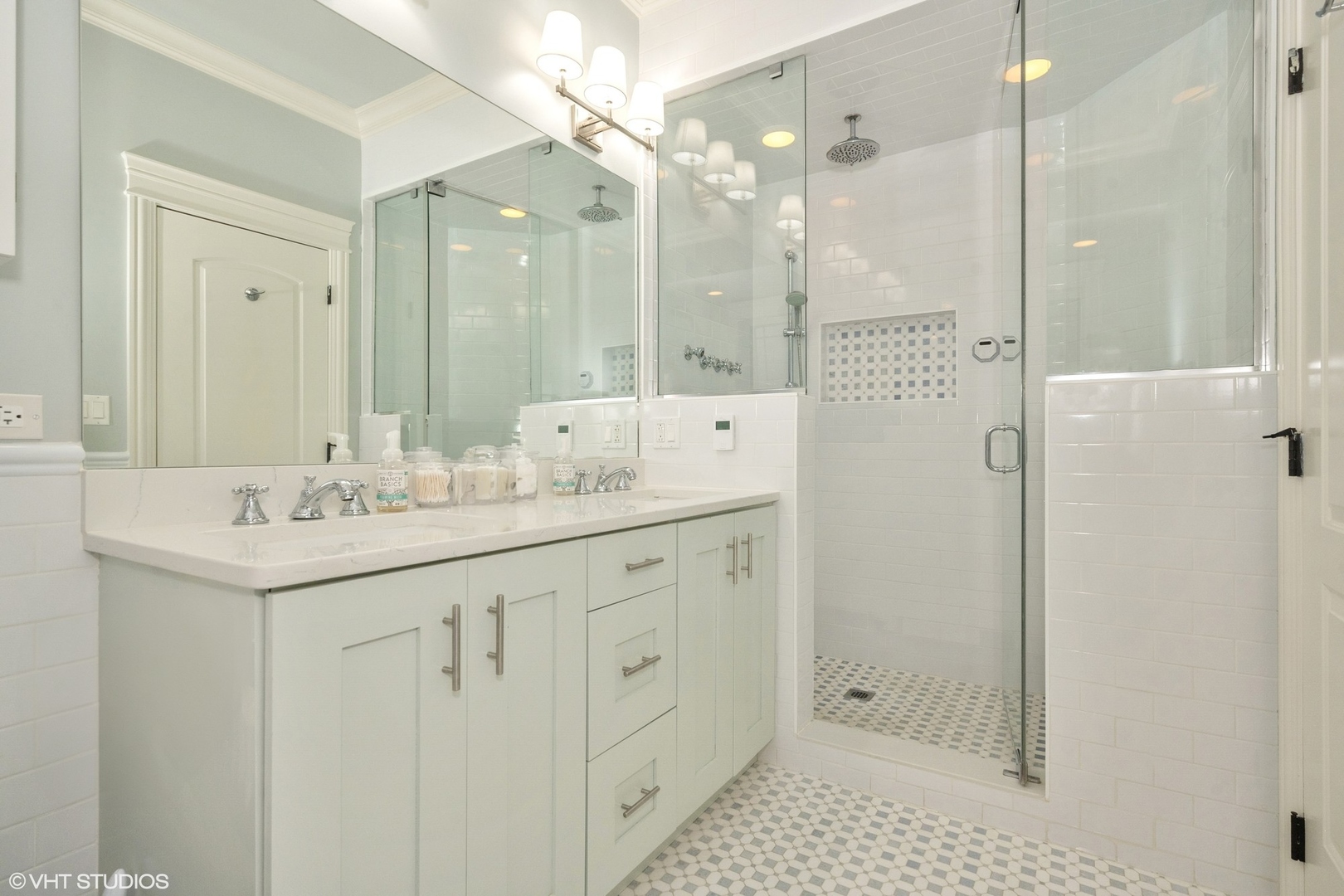 858 West Diversey Parkway, Unit 1W Chicago, IL 60614 - Photo 11 of 20 a bathroom with a shower sink vanity and mirror