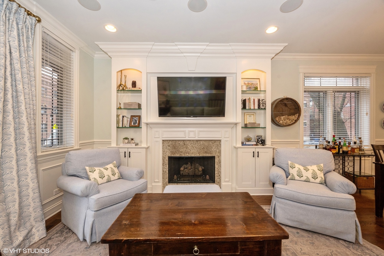 858 West Diversey Parkway, Unit 1W Chicago, IL 60614 - Photo 2 of 20 a living room with furniture a flat screen tv and a fireplace